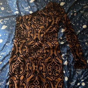 Brown and black one sleeve dress.